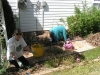glenda-and-jackie-pulling-weed-in-the-side-yard